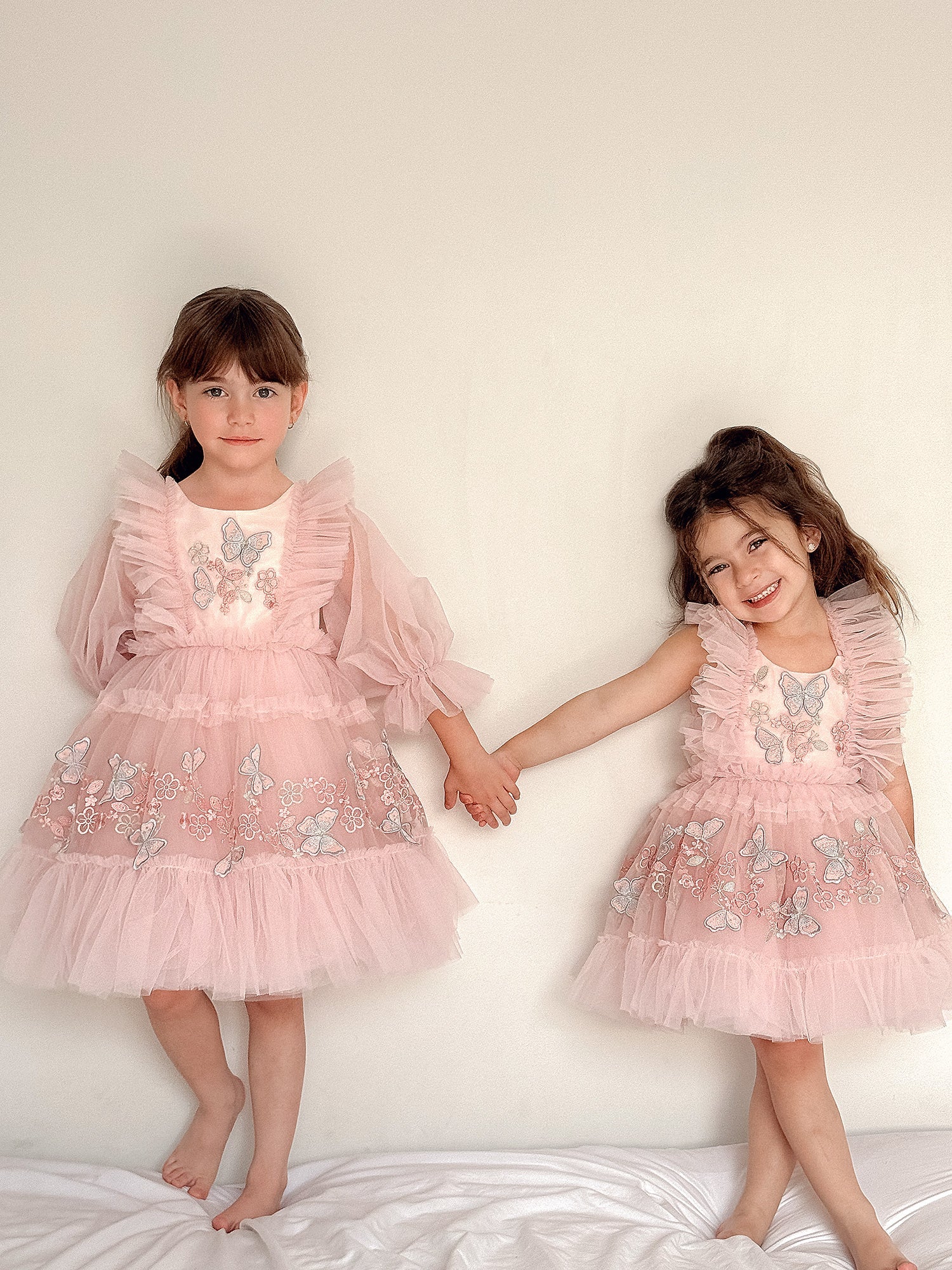 Blush pink tulle dress, round neck, sleeveless with ruffle tulle shoulders, 3D butterfly and floral embroidery, tiered tulle skirt, above knee length, for birthday and photoshoot.