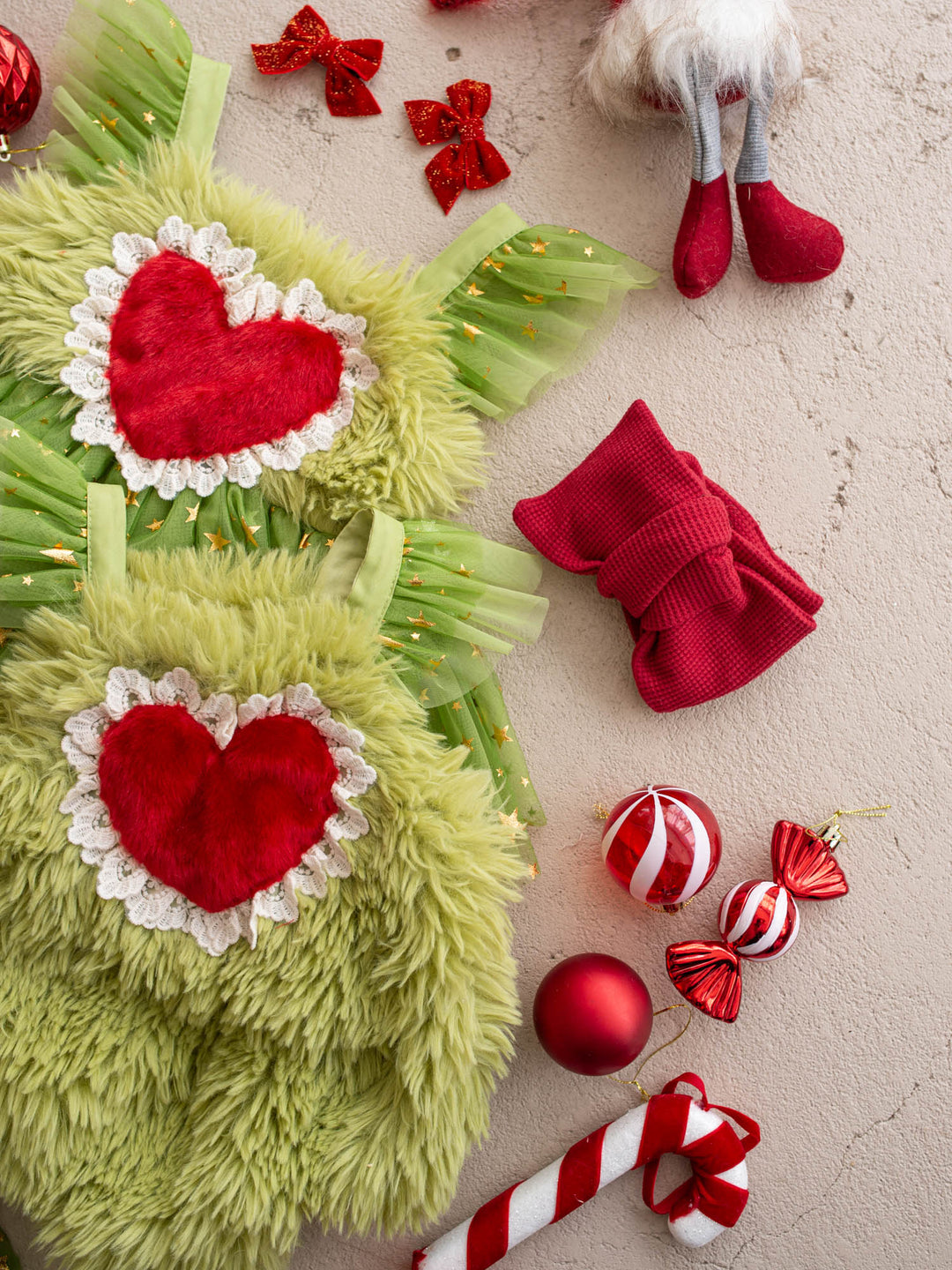 Matching Miss Grump dress and Little Grump romper side by side, both with red fur hearts and lace trim, for sisters at Christmas - Before & Ever Kids