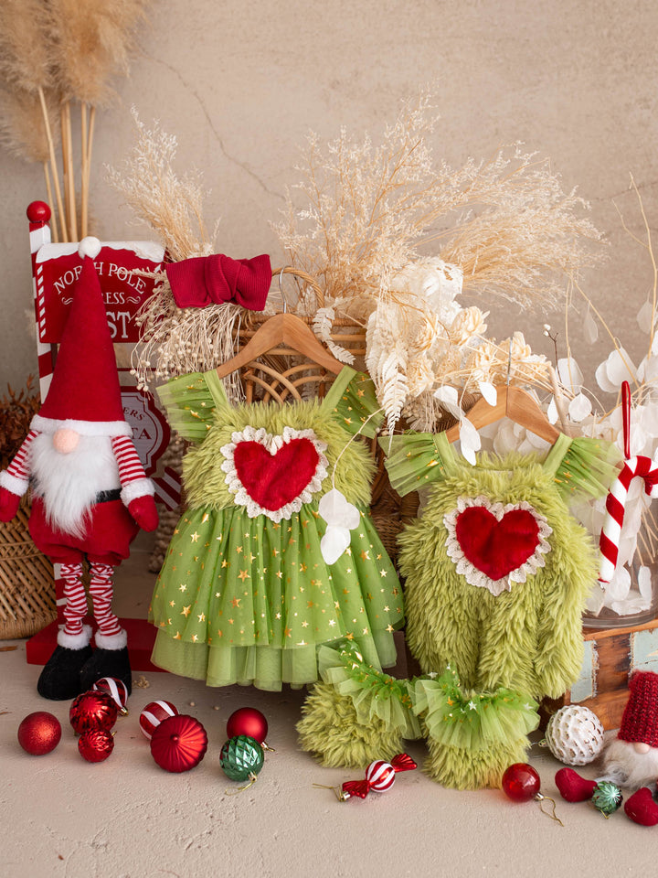 Matching Miss Grump dress and Little Grump romper hanging side by side with a Santa gnome and red baubles - Before & Ever Kids