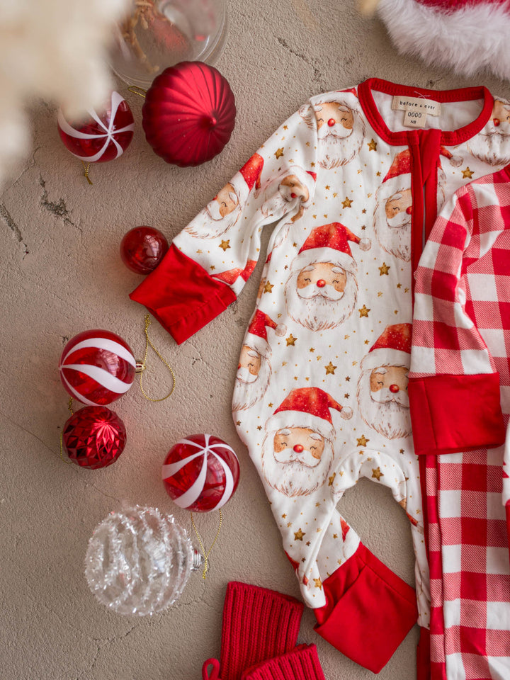 All I Wish Christmas baby onesies laid out together including the Dear Santa print - Before & Ever Kids
