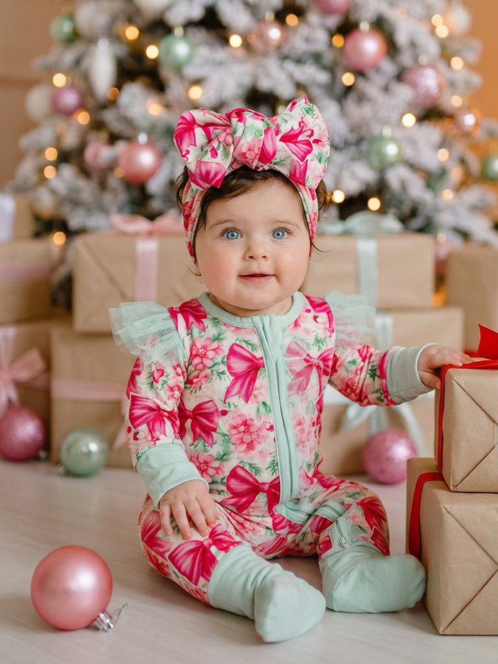 All I Wish Pink Bow baby onesie worn by a baby girl with the matching topknot headwrap, mint cuffs and mint tulle flutter sleeves - Before & Ever Kids