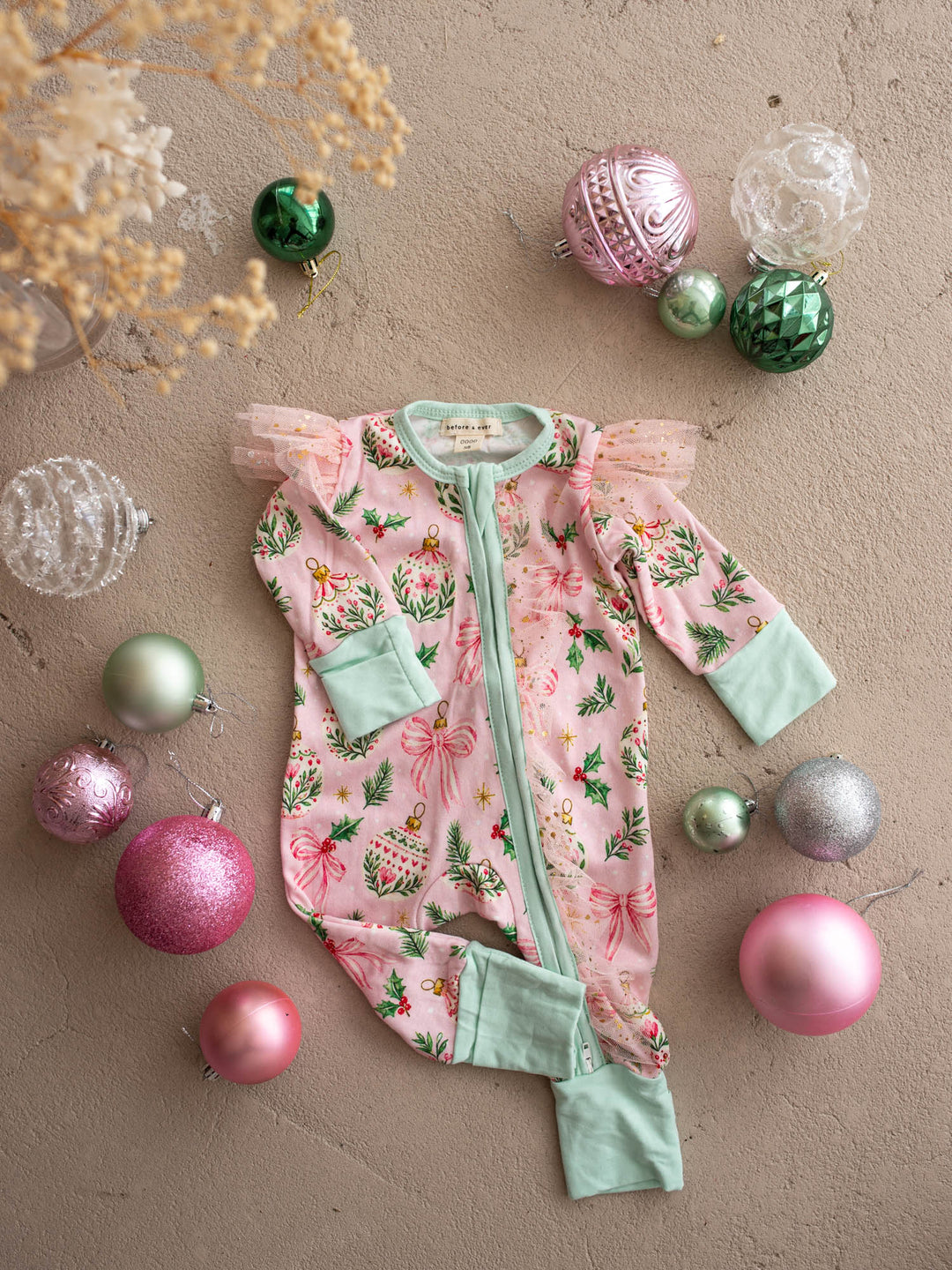 All I Wish Pink Holly baby onesie, holly, gold baubles and bows on pink with mint cuffs - Before & Ever Kids
