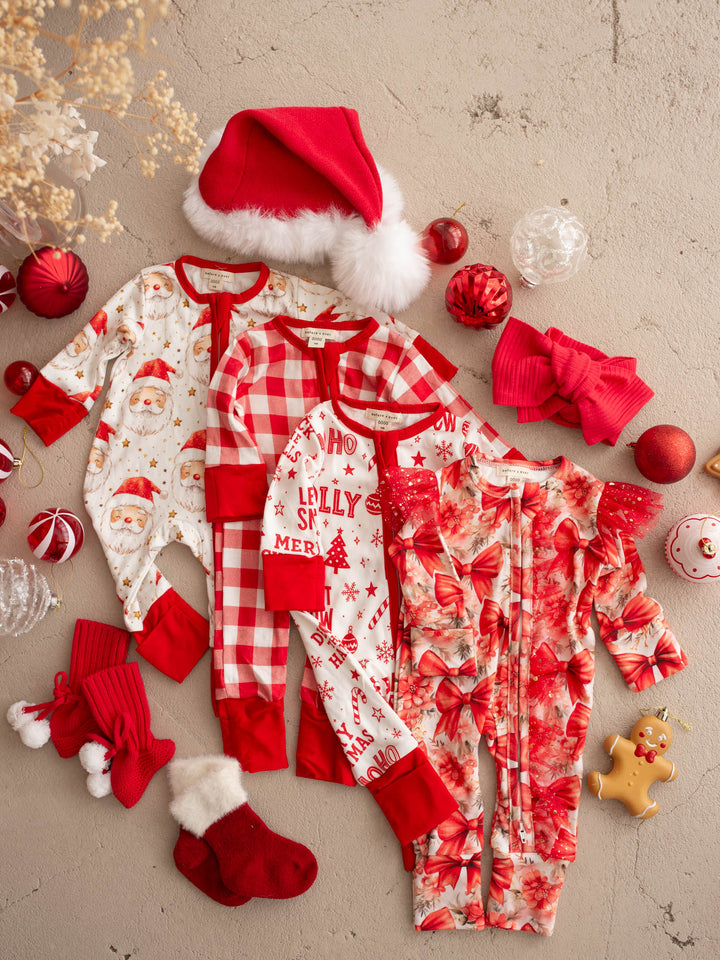 All I Wish Christmas baby onesies laid out together including the Red Gingham print - Before & Ever Kids