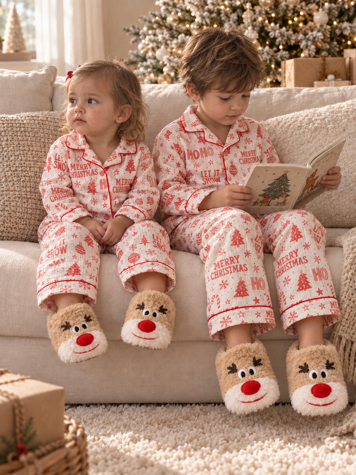 Baby Rudolph Slippers tan plush reindeer slippers worn by two children sitting on a sofa at Christmas - Before & Ever Kids