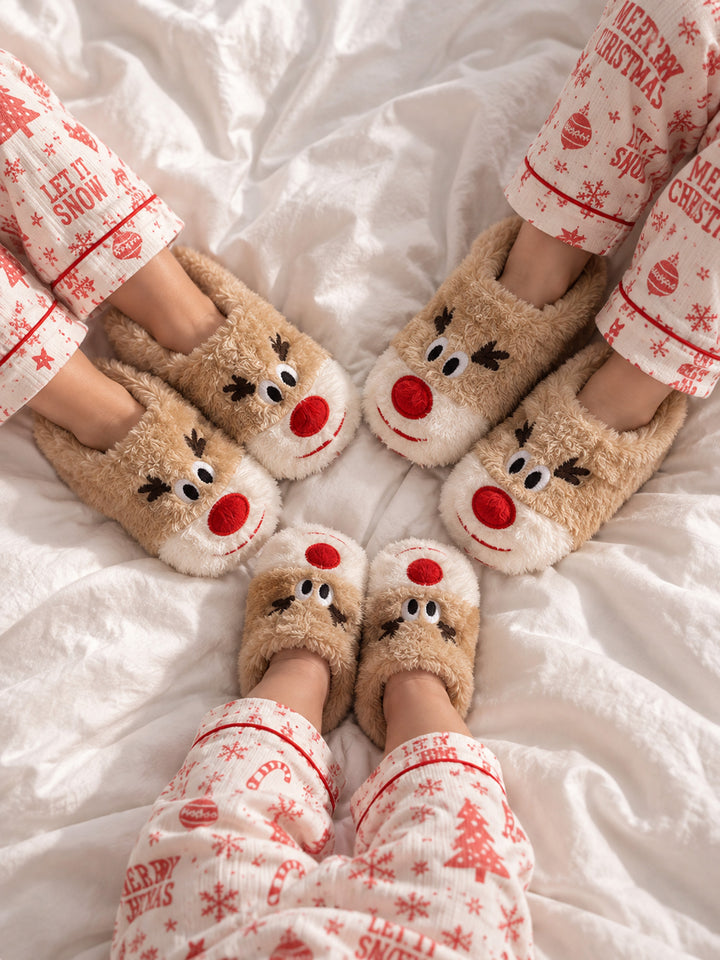 Baby Rudolph Slippers tan plush reindeer slippers in three sizes together, antlers and red noses, overhead view - Before & Ever Kids