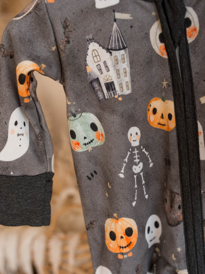 Close up of Boo Crew Halloween print with ghosts, haunted house and jack-o-lanterns on charcoal bamboo onesie - Before & Ever Kids