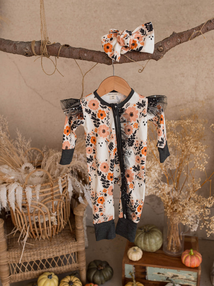 Boo-quet Halloween baby girl onesie hanging with its matching floral topknot headwrap - Before & Ever Kids