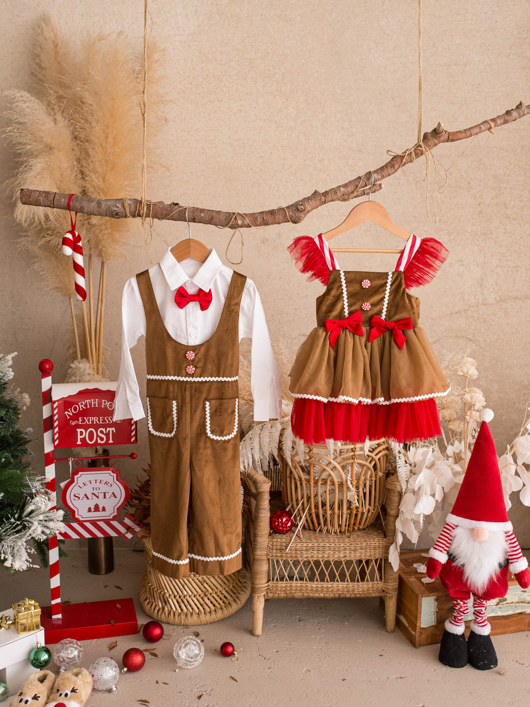 Catch Me If You Can caramel velvet boy overall, hanging beside a gingerbread dress on a branch - Before & Ever Kids