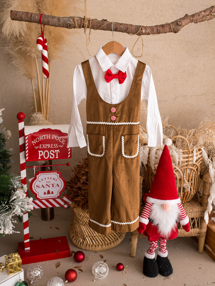 Catch Me If You Can caramel velvet boy overall, hanging with the shirt and bow tie beside a Christmas post box and gnome - Before & Ever Kids
