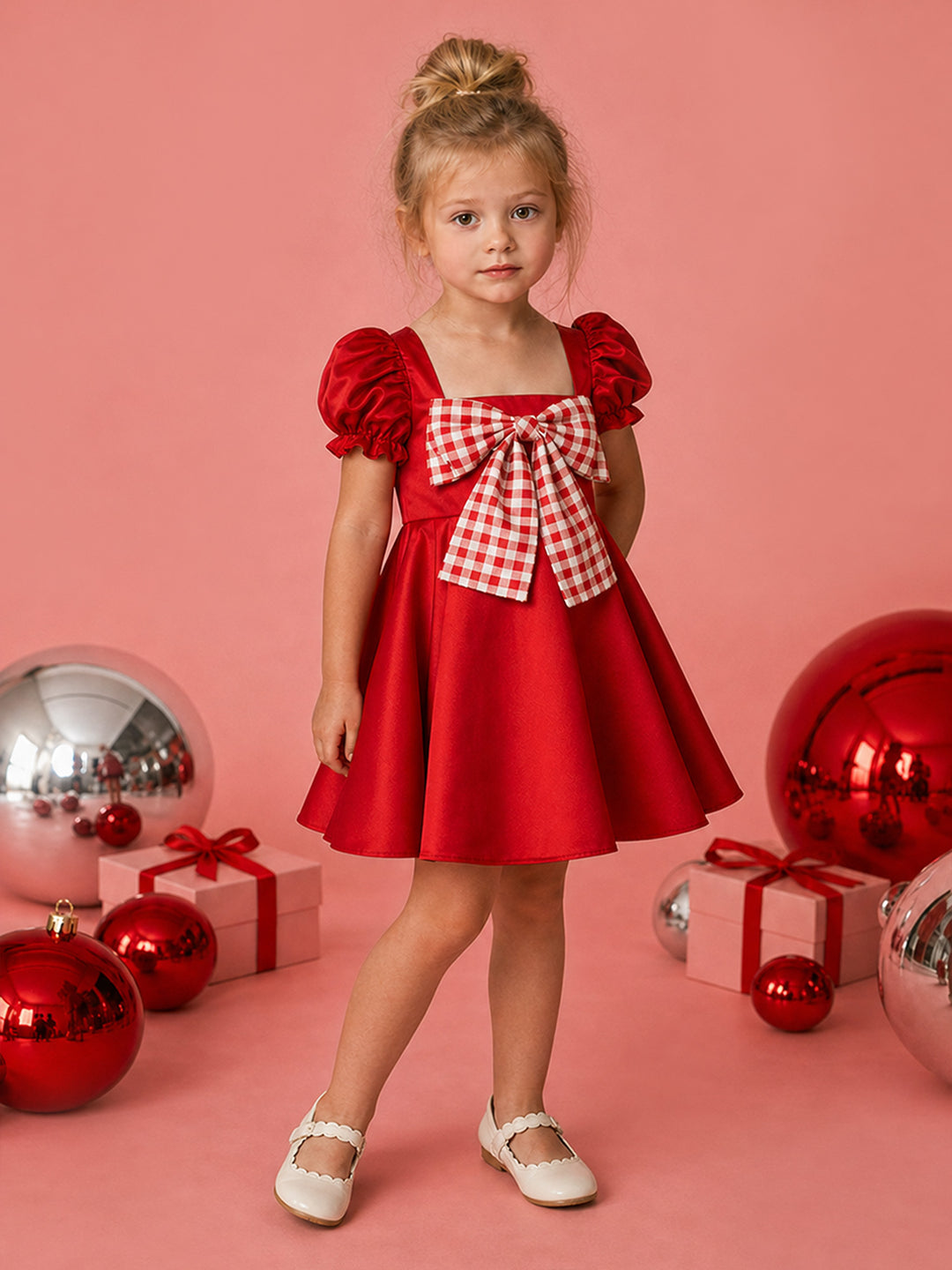 Cherry on Top red satin Christmas dress with puff sleeves and a red gingham bow, full length front view with red baubles