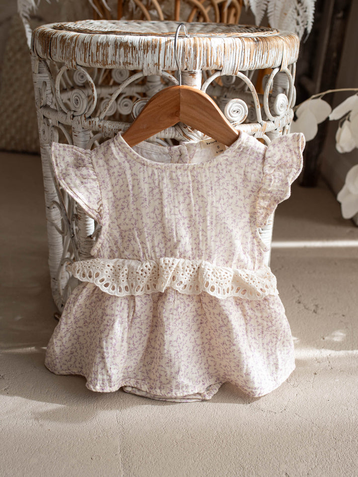Dainty Miss Lavender Mae baby girl lavender floral cotton gauze romper with eyelet lace ruffle and flutter sleeves - Before & Ever Kids