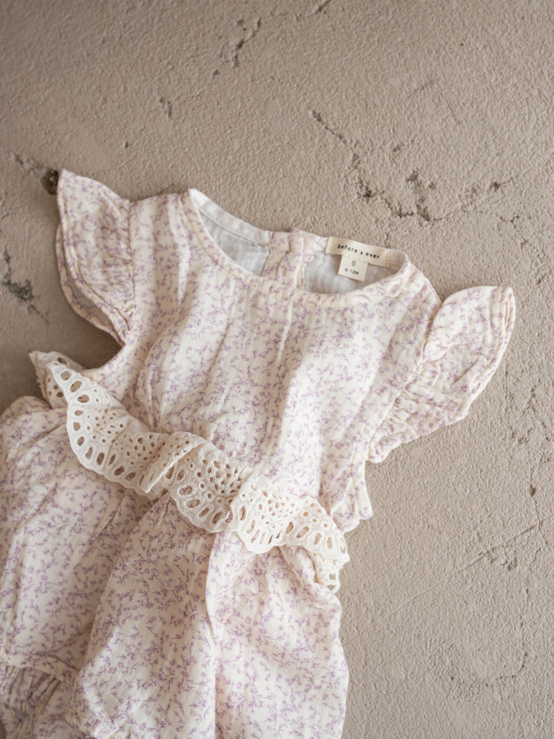 Dainty Miss Lavender Mae baby girl lavender floral cotton gauze romper with eyelet lace ruffle and flutter sleeves - Before & Ever Kids