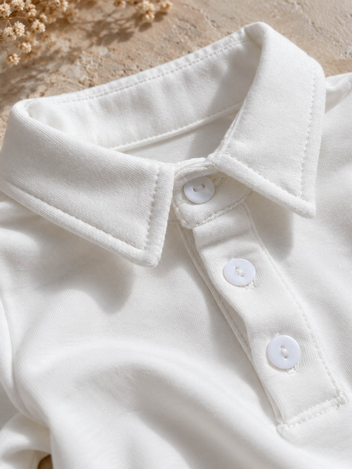 Everyday Cotton Polo, white long sleeve cotton polo, close up of the collar and buttons - Before & Ever Kids