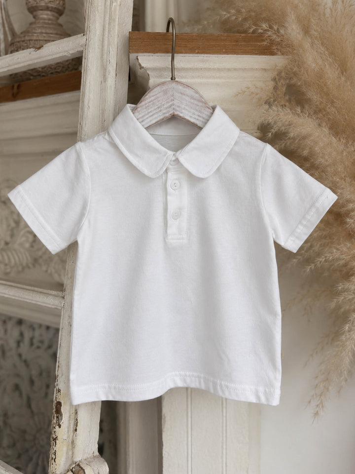 Everyday Cotton Polo, white short sleeve cotton polo, on a hanger, full front - Before & Ever Kids