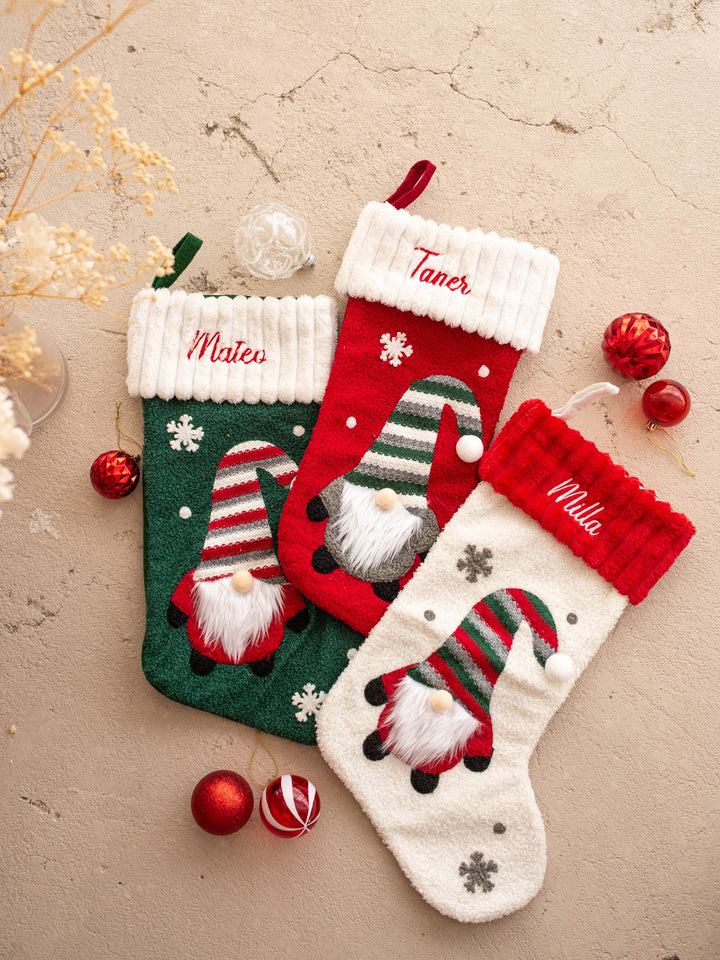 Gnome For Christmas personalised Christmas stocking, all three colours laid flat together, green, red and cream, each with a name on the cuff - Before & Ever Kids