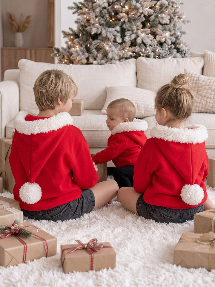 Ho Ho Hoodie red kids hoodies, back view of three children sitting together with the hoods down - Before & Ever Kids