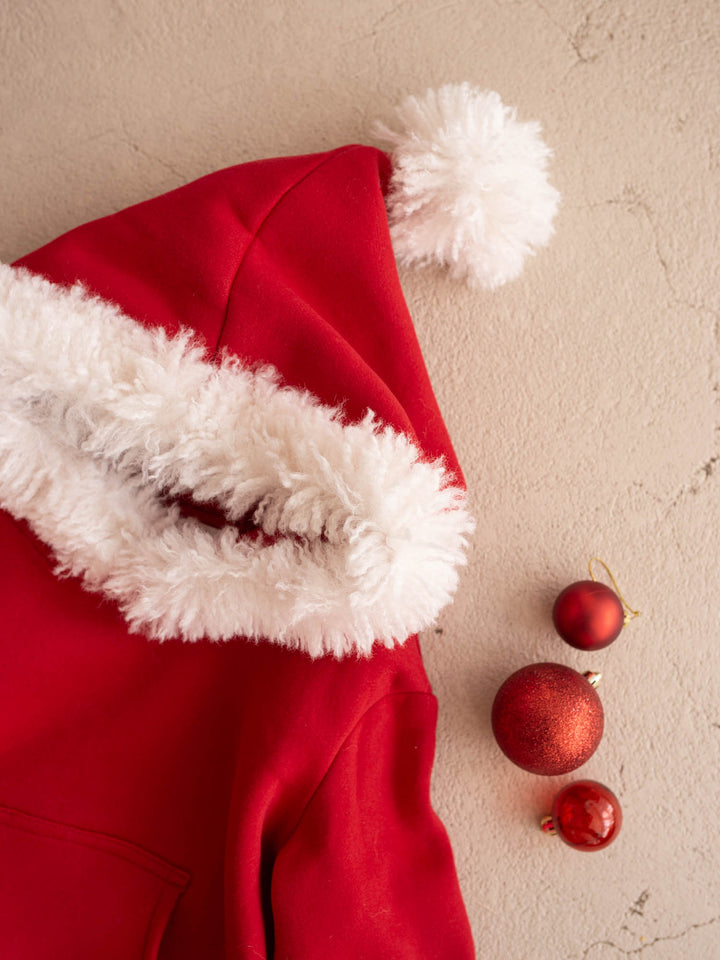 Close up of the white fluffy hood trim and pom-pom on the Ho Ho Hoodie - Before & Ever Kids