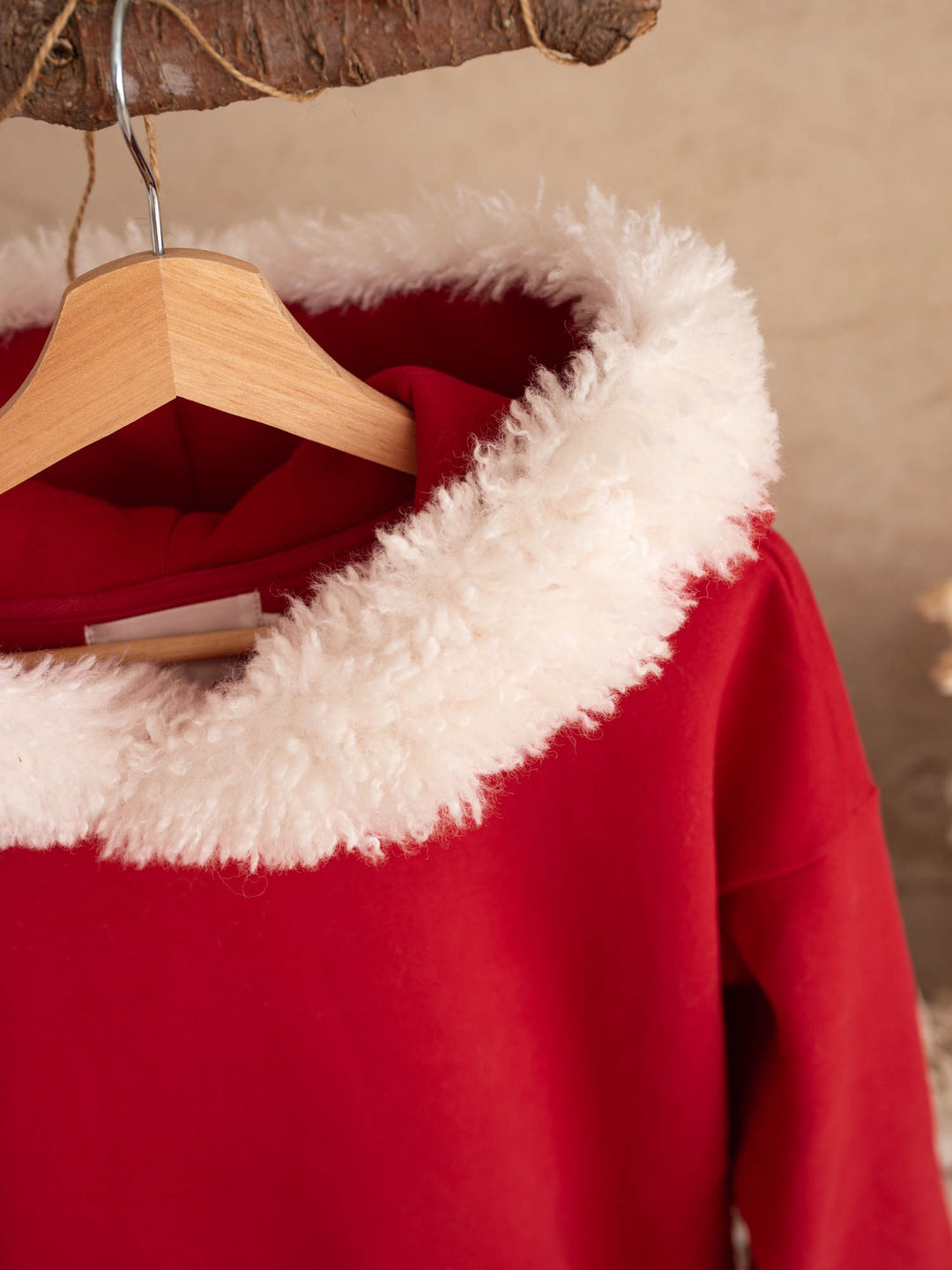 Close up of the white fluffy hood trim on the Ho Ho Hoodie adult - Before & Ever Kids