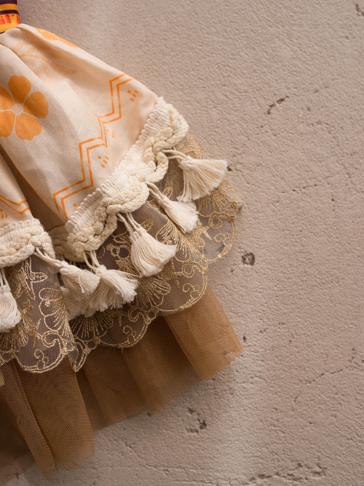 Island Princess island-inspired girls dress tassel hem close-up - Before & Ever Kids