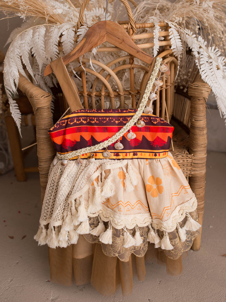 Island Princess island-inspired girls dress full dress styled on a rattan chair - Before & Ever Kids