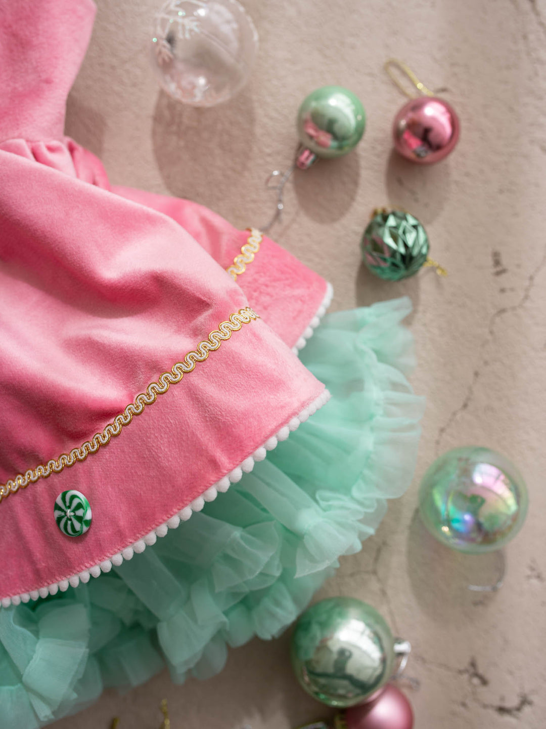 Merry Berry pink and mint pink velvet pinafore with peppermint buttons shown with its detachable mint tulle tutu skirt - Before & Ever Kids