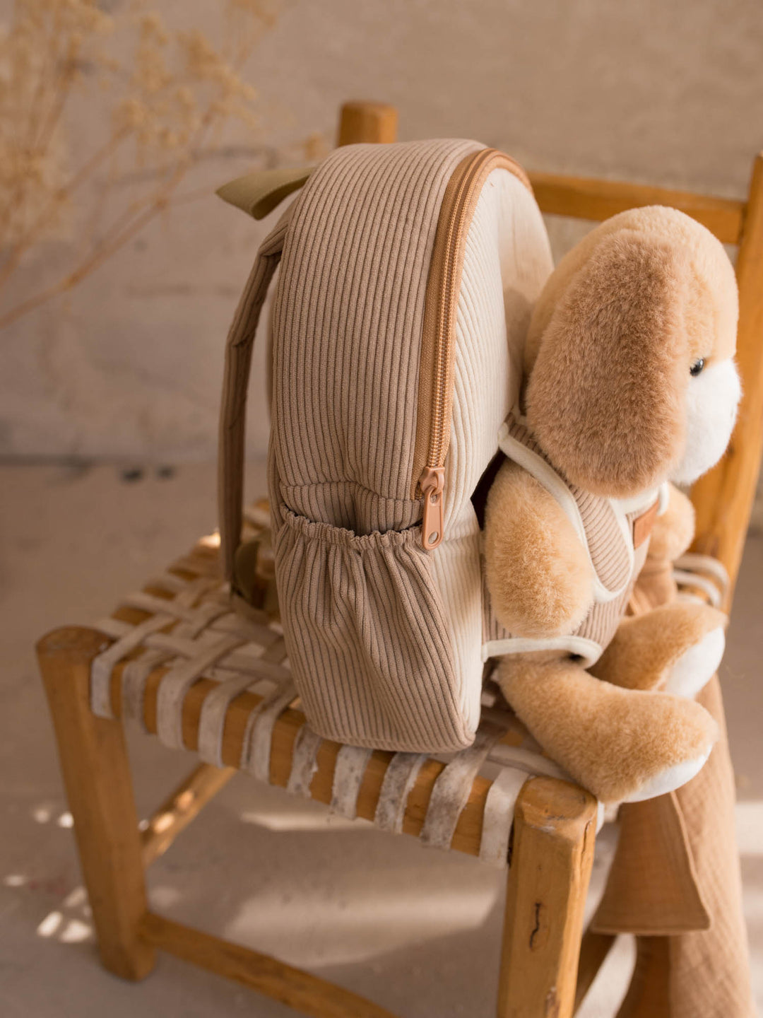 Milo the Puppy personalised plush backpack for kids, side view of the backpack with the puppy - Before & Ever Kids
