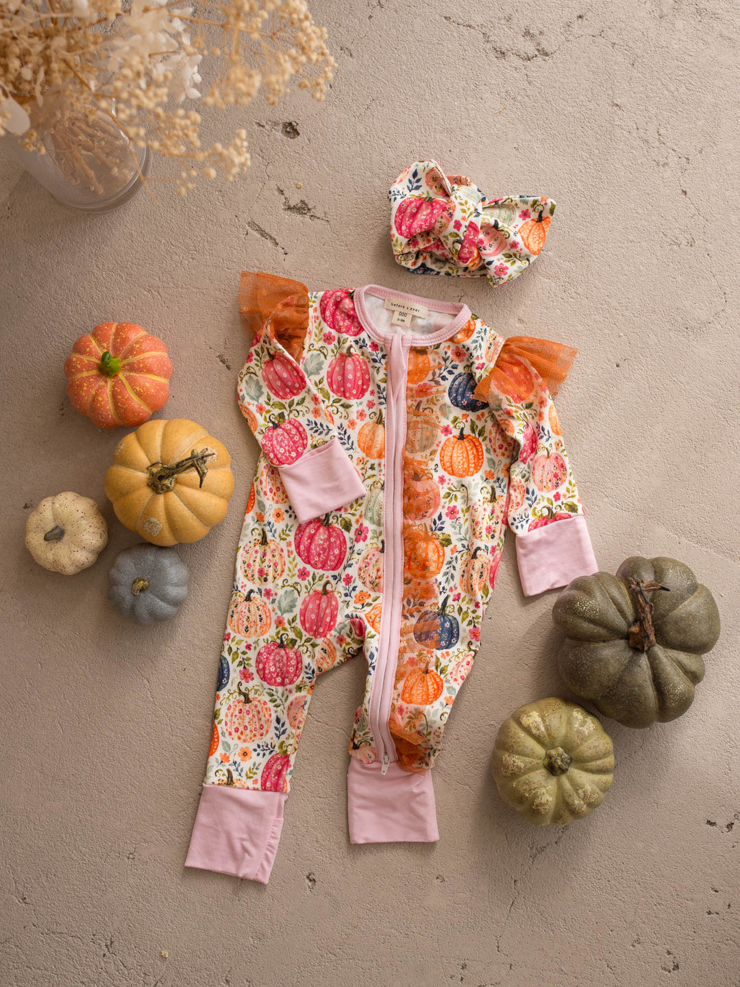 Patch Perfect pumpkin floral baby girl onesie flat lay with matching topknot headwrap - Before & Ever Kids