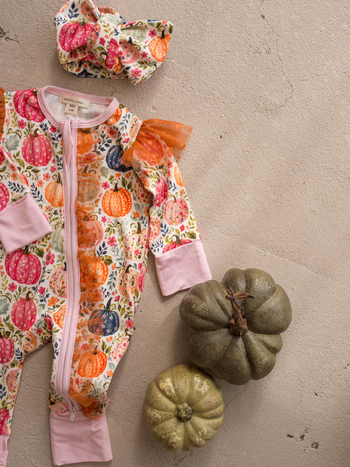 Patch Perfect pink pumpkin bamboo baby girl onesie flat lay with topknot - Before & Ever Kids