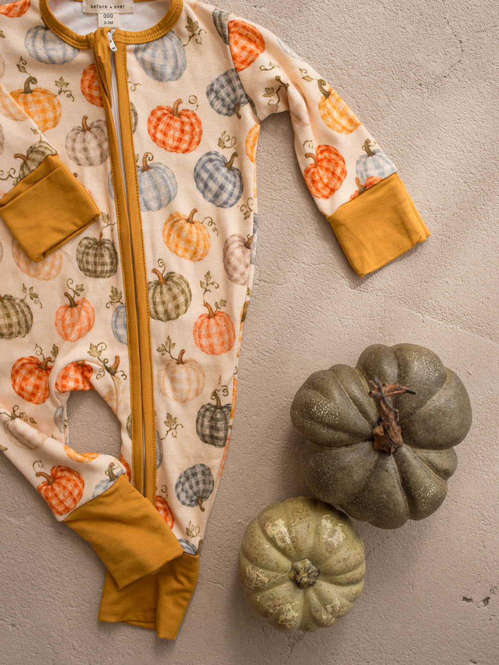 Patch Ready pumpkin onesie flat lay detail with mustard binding - Before & Ever Kids