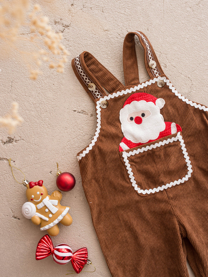 Peekaboo Overall in Santa, chocolate cotton corduroy overall with a Santa face pocket, close on the Santa appliqué and white ric rac trim - Before & Ever Kids