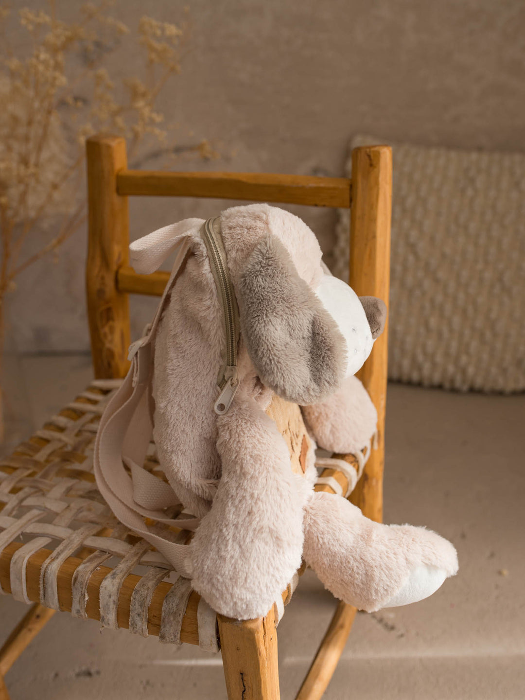 Pip the Puppy plush backpack for kids, side view showing the zip along the back - Before & Ever Kids