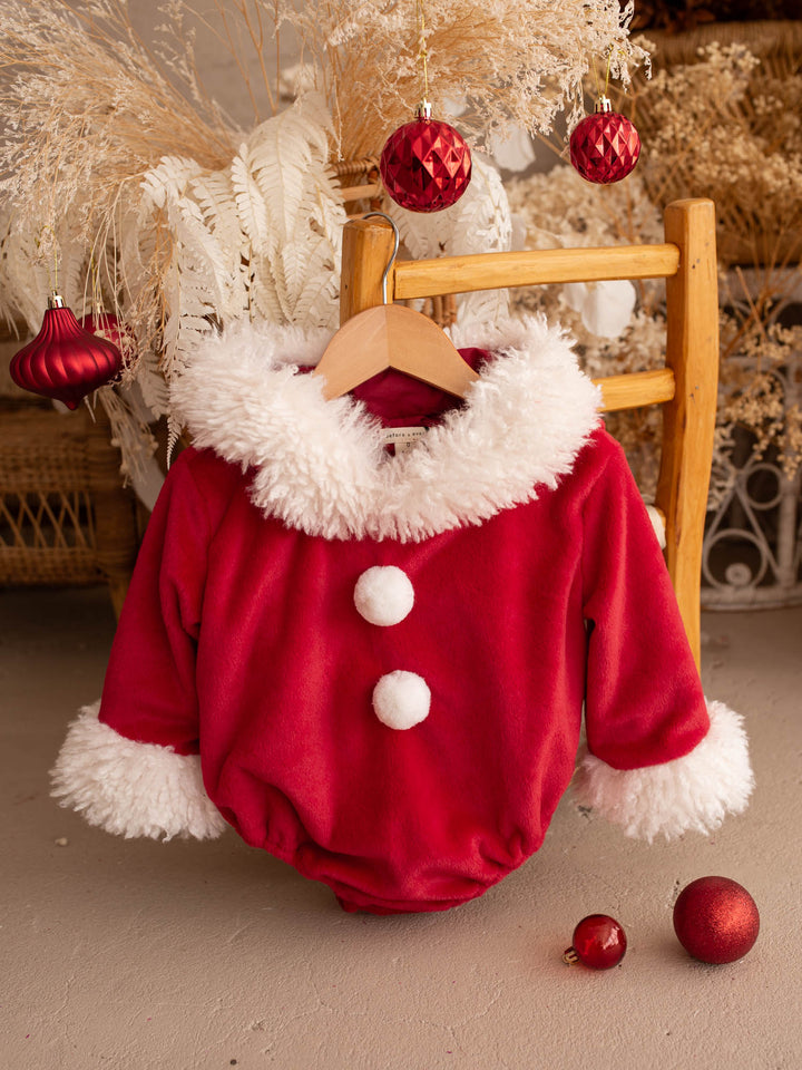 Santa Baby Romper red velvet hooded romper for babies, front view, white fluffy trim and two white pom-poms - Before & Ever Kids