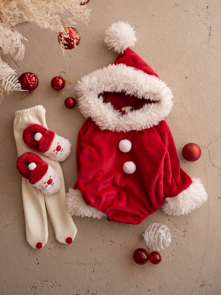 Santa Baby Romper, cream tights and Santa Baby Slippers laid out together - Before & Ever Kids