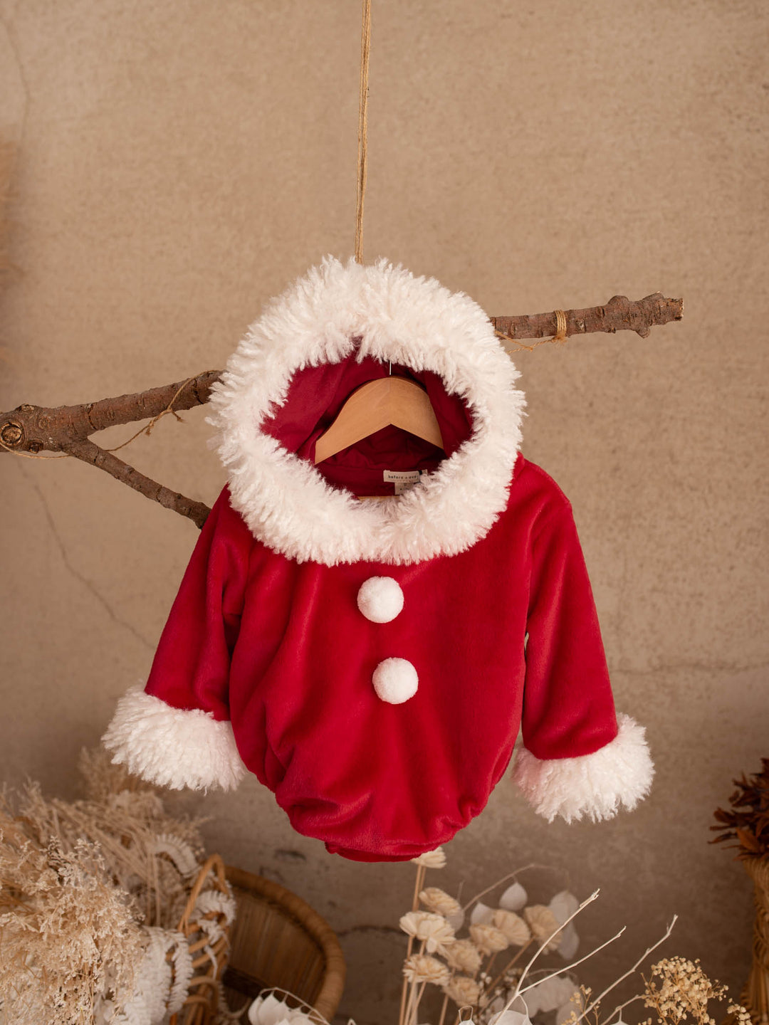 Santa Baby Romper with the Santa hat hood folded forward, white fluffy trim - Before & Ever Kids