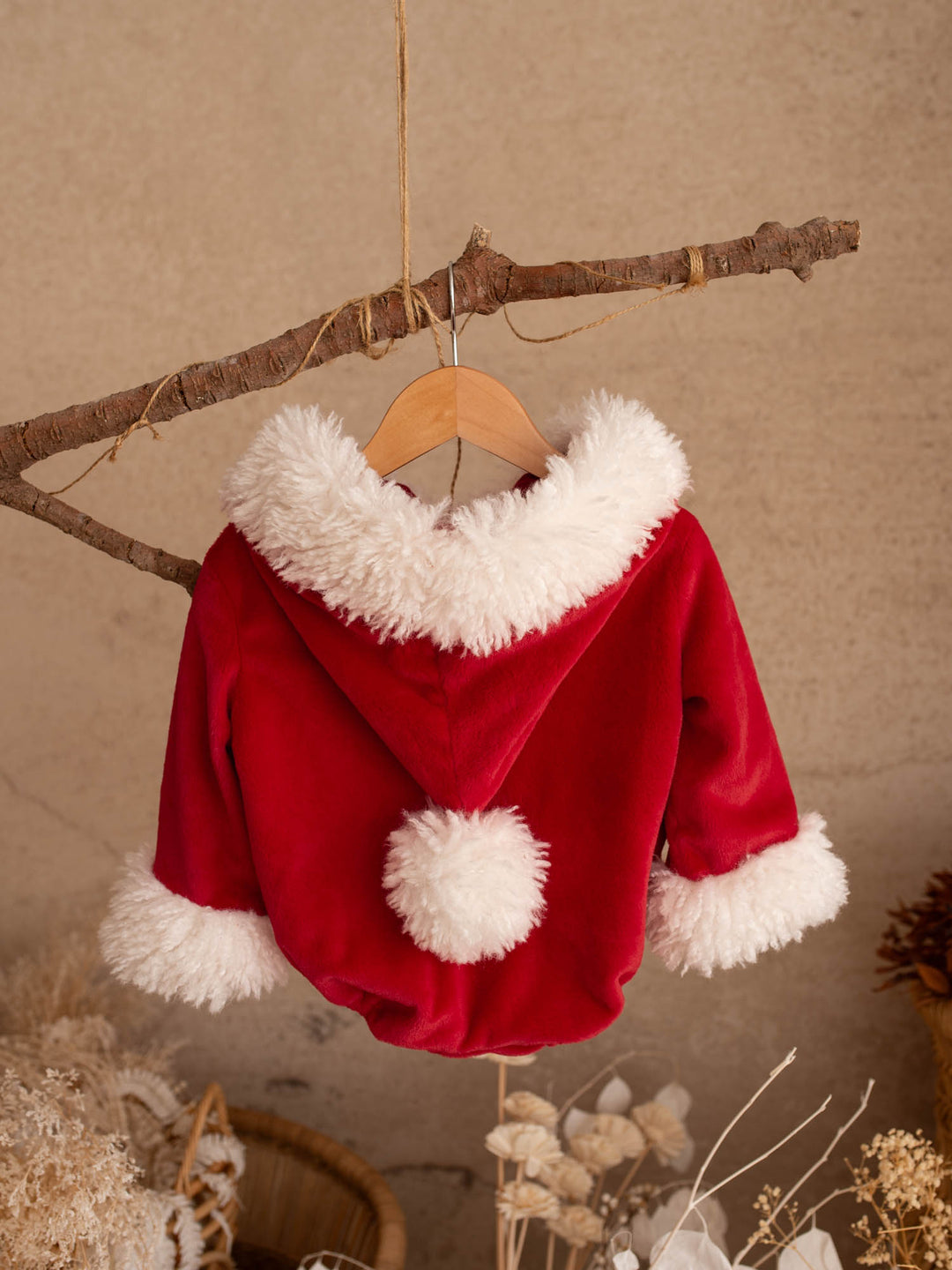 Santa Baby Romper back view showing the hood and white pom-pom - Before & Ever Kids