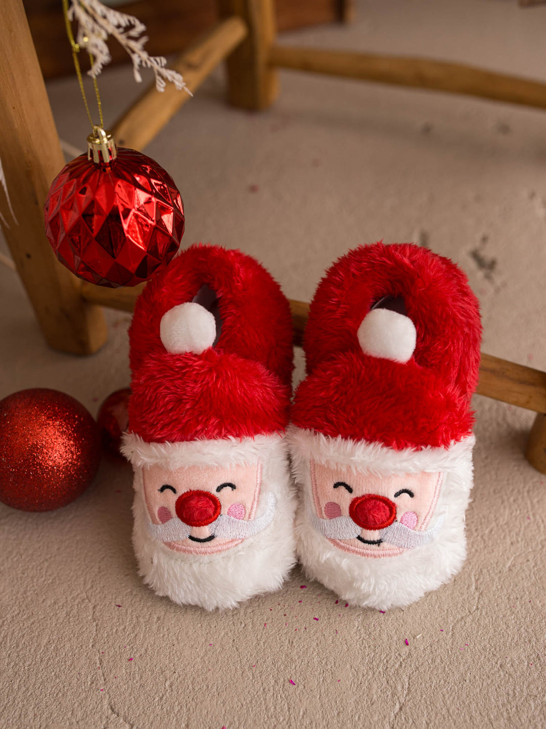 Santa Baby Slippers, red fluffy Santa face slippers for babies, front view - Before & Ever Kids