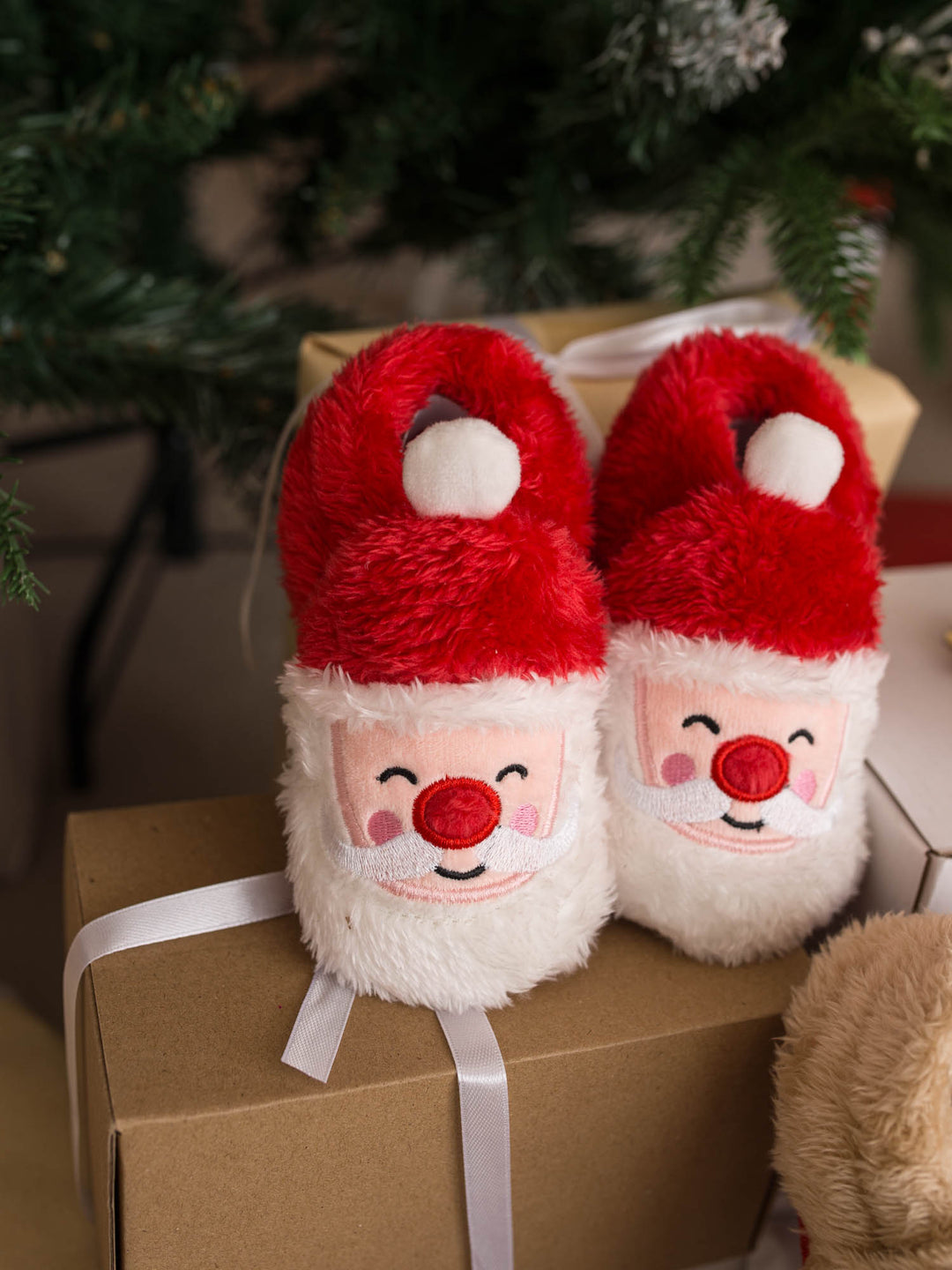 Santa Baby Slippers red fluffy Santa slippers on a gift box - Before & Ever Kids