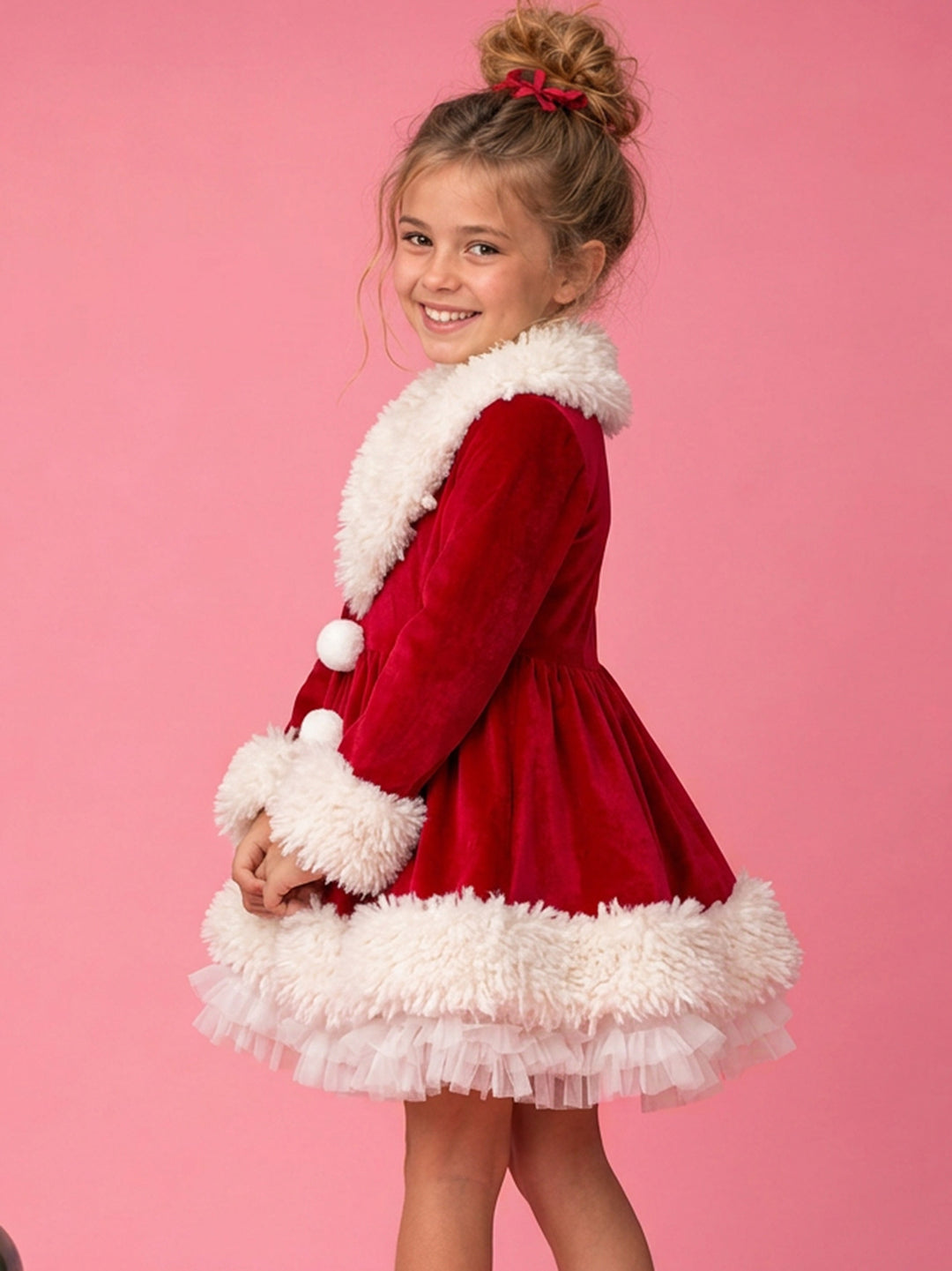 She Came to Sleigh red velvet Santa dress worn by a girl, back and side view showing the fur hem and white tutu underskirt - Before & Ever Kids