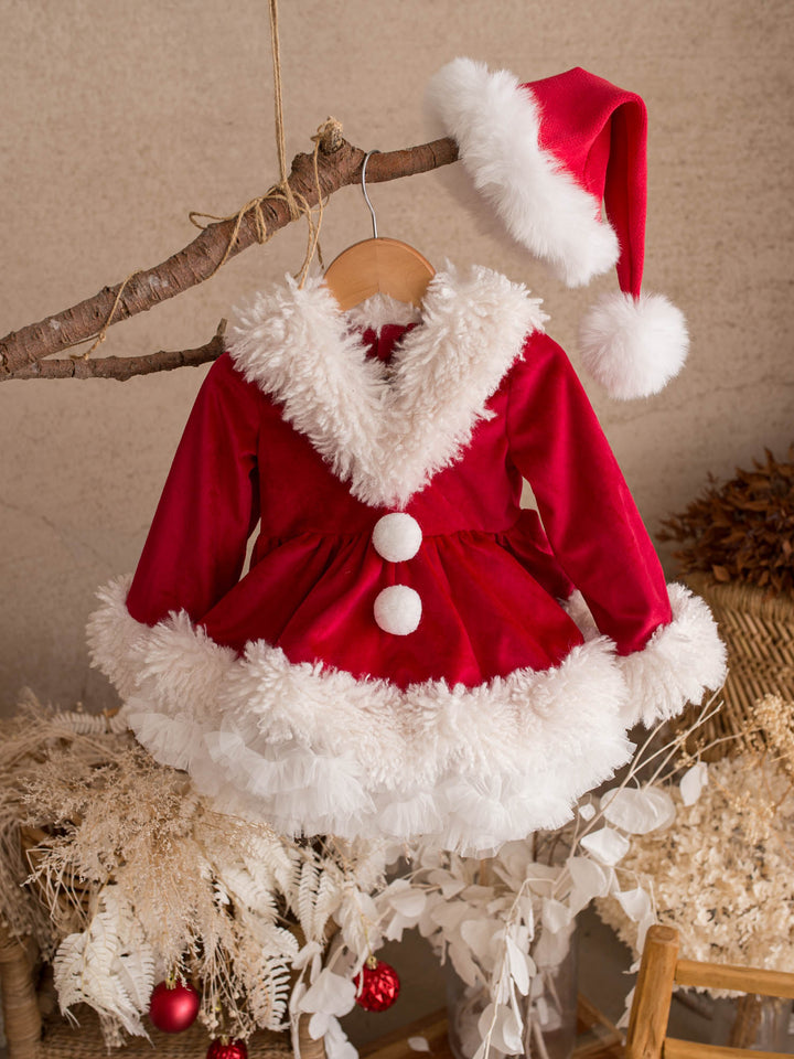 She Came to Sleigh red velvet Santa dress hanging on a branch with a Santa hat - Before & Ever Kids