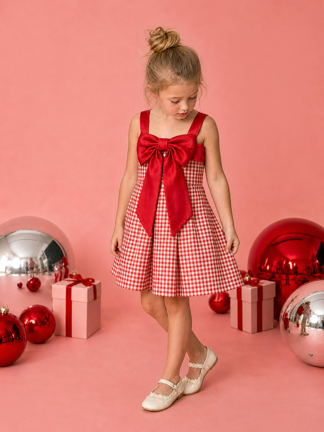 Sweet as Pie red and white gingham Christmas dress with a red satin bow, full length front view with red baubles and gifts