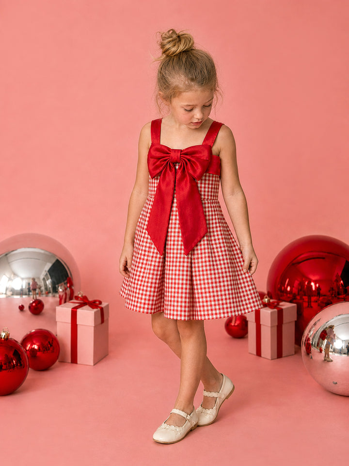Sweet as Pie red and white gingham Christmas dress with a red satin bow, full length front view with red baubles and gifts