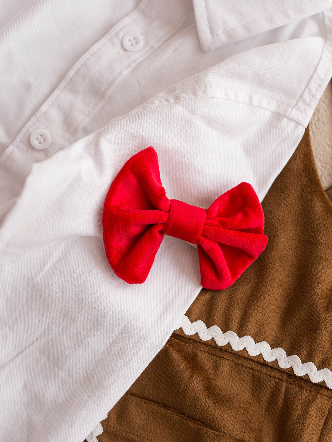 Velvet Bow Tie in red, boys clip on velvet bow tie, laid flat on a white shirt, showing the velvet pile - Before & Ever Kids