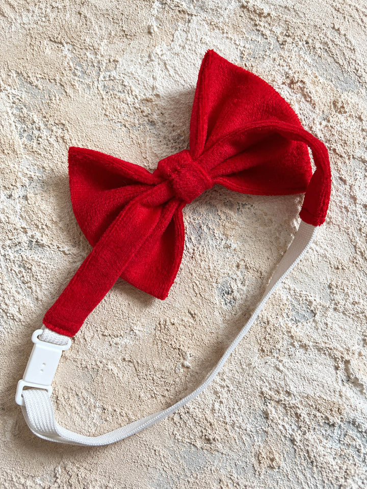 Velvet Bow Tie in red, the strap folded behind the bow showing the clip fastening - Before & Ever Kids