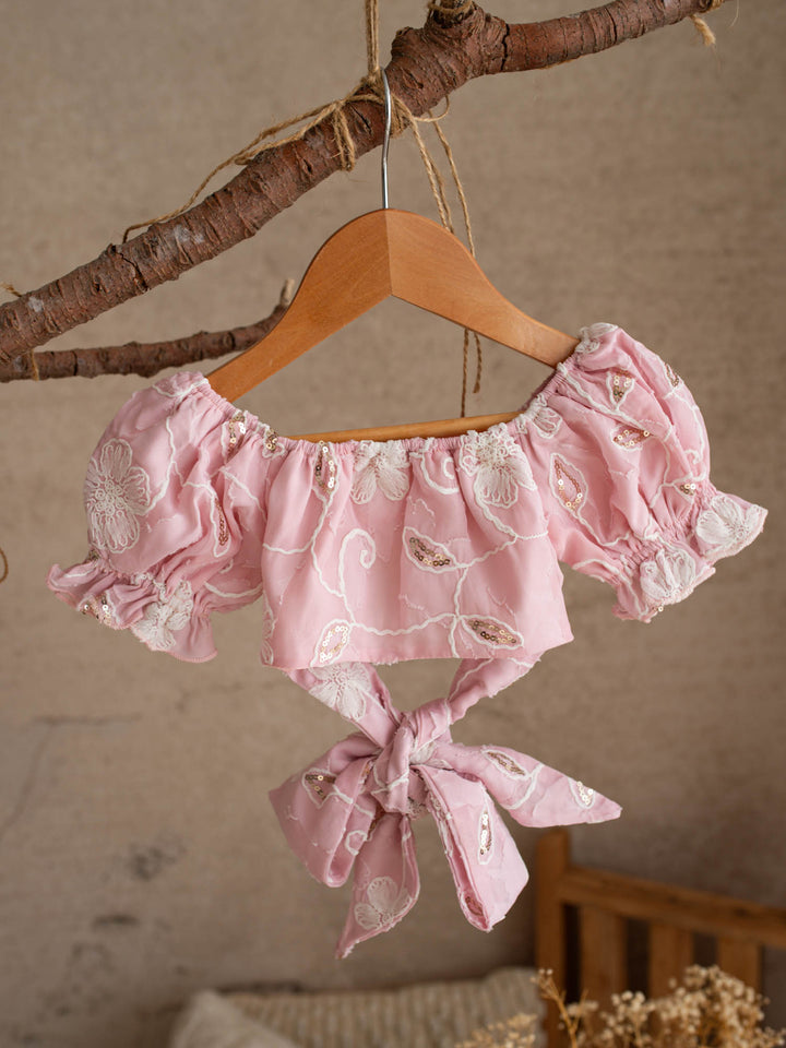 Where Summer Blooms baby pink baby girl set with white floral embroidery, gold sequins, puff sleeves and a bubble-hem skort.