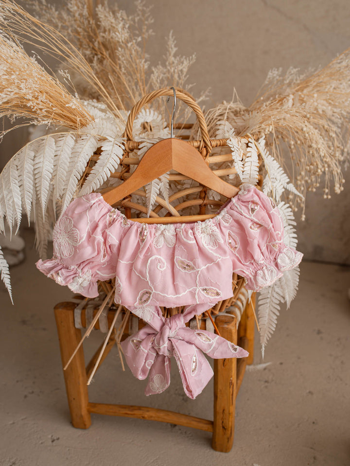Where Summer Blooms baby pink baby girl set with white floral embroidery, gold sequins, puff sleeves and a bubble-hem skort.