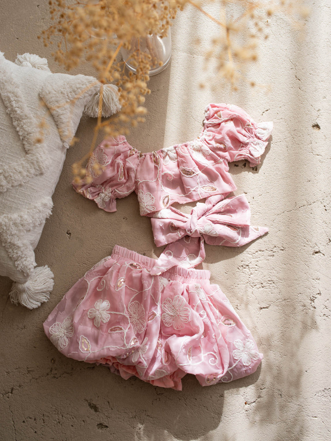 Where Summer Blooms baby pink baby girl set with white floral embroidery, gold sequins, puff sleeves and a bubble-hem skort.