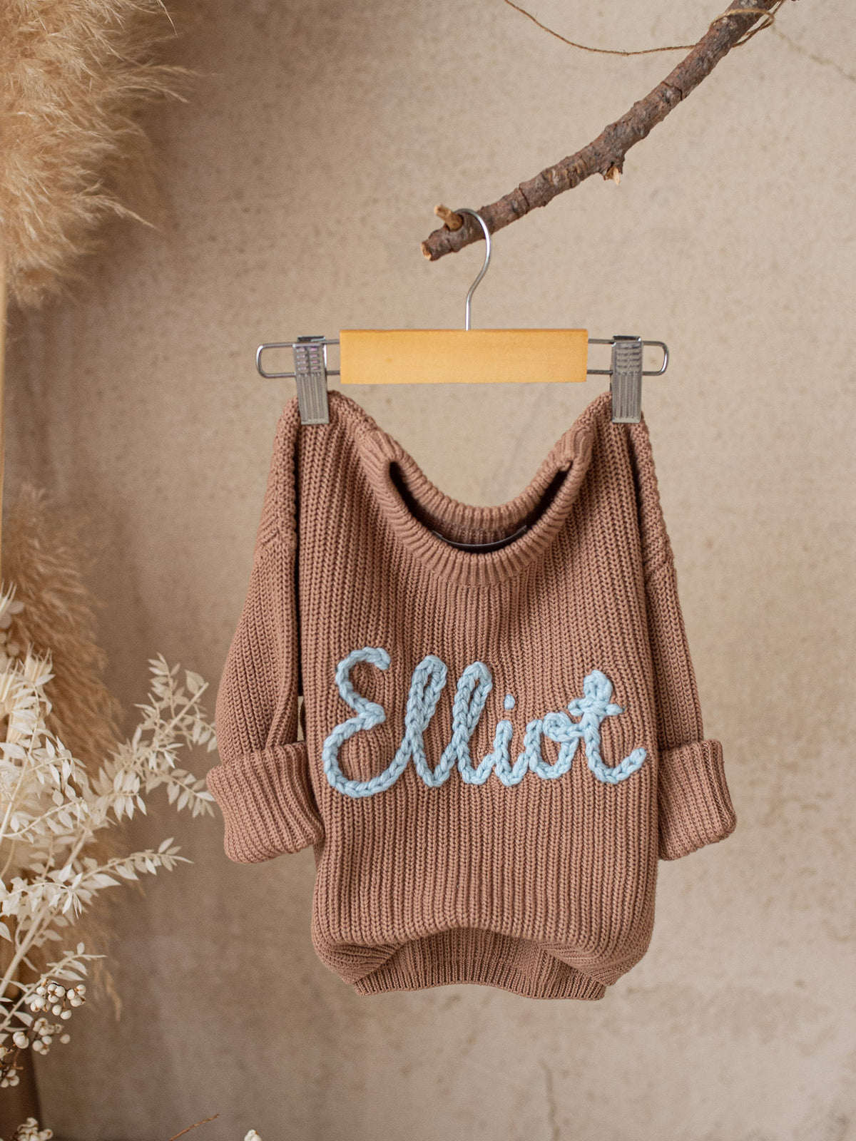 Cocoa Written in Thread baby sweater in chunky cotton knit with hand-embroidered name, long sleeves.